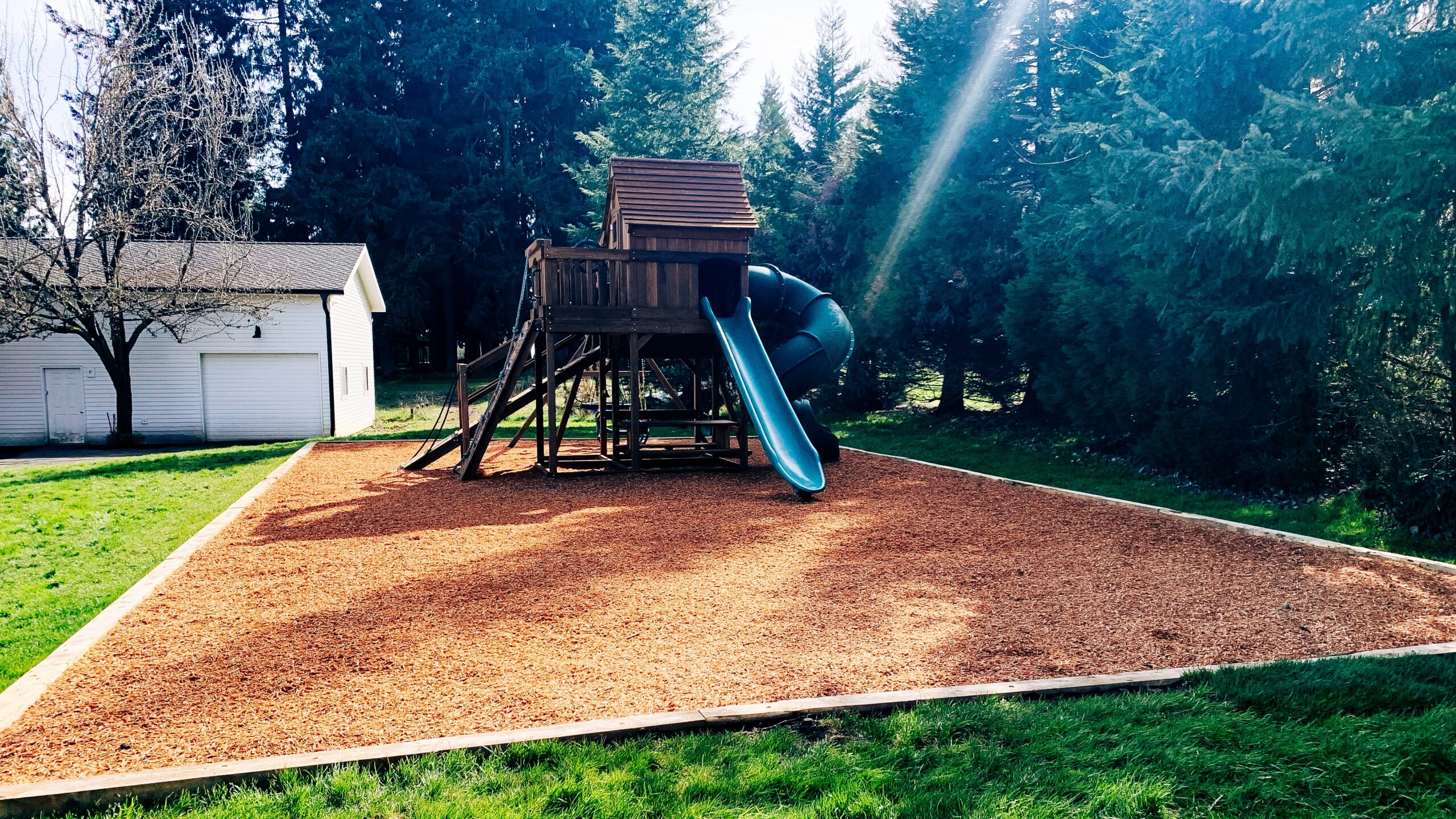 Kids play structure bark installation in Vancouver, WA