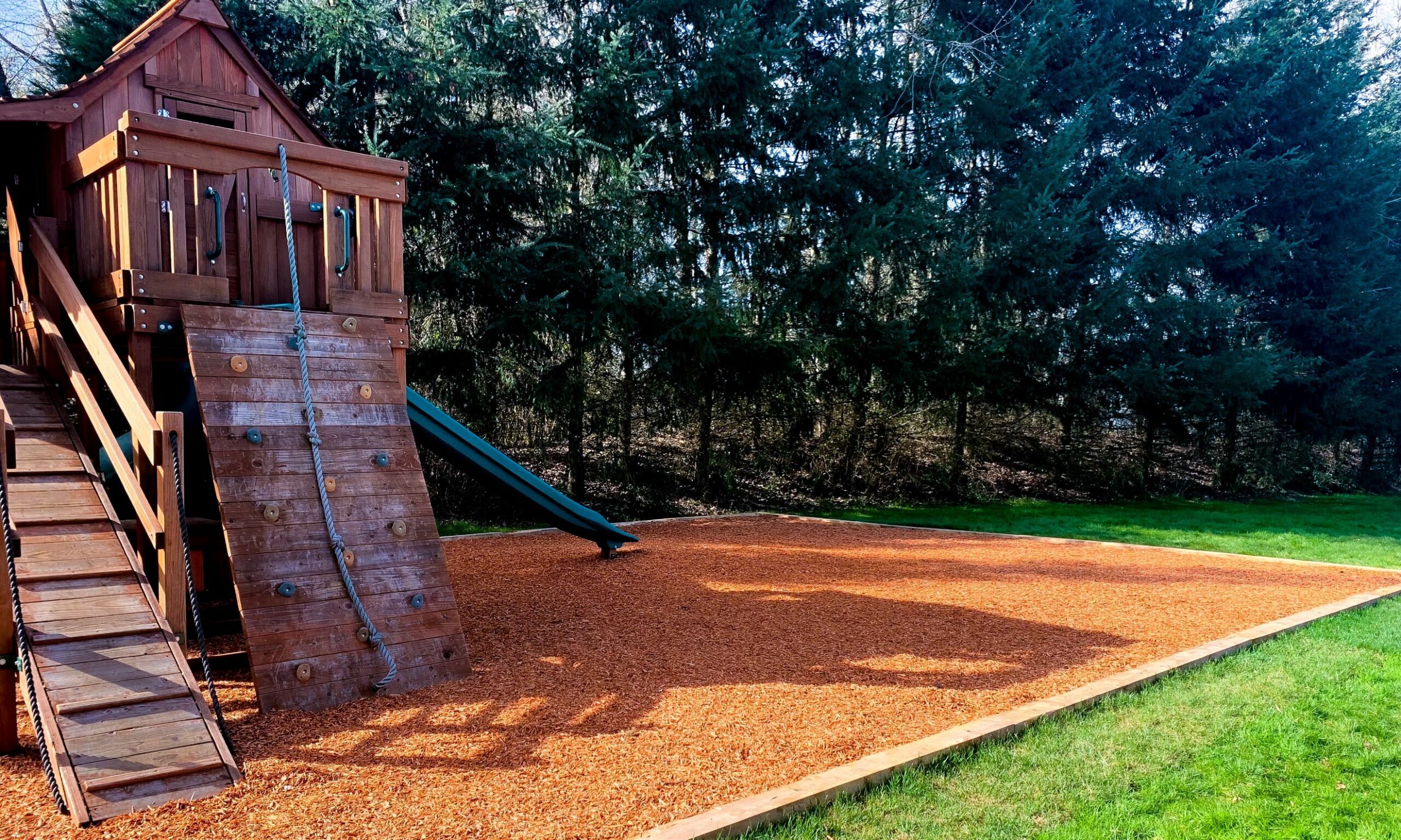 Kids play structure bark installation in Vancouver, WA