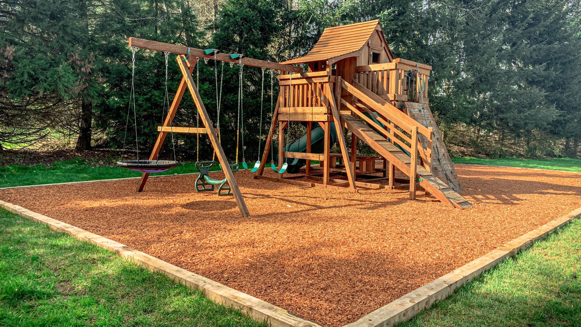 Kids play structure bark installation in Vancouver, WA